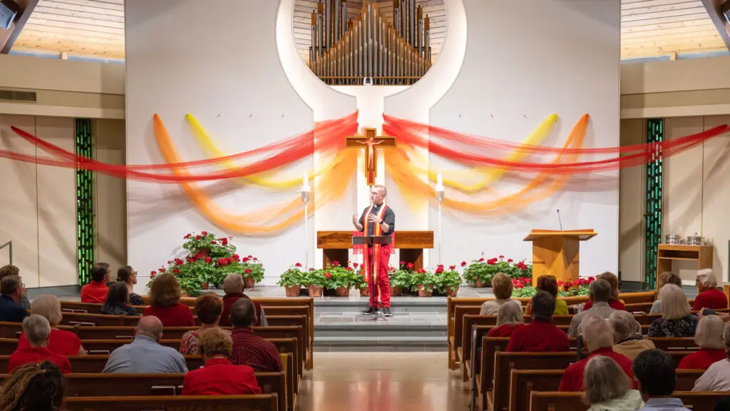 Pastor TJ preaching to the congregation.